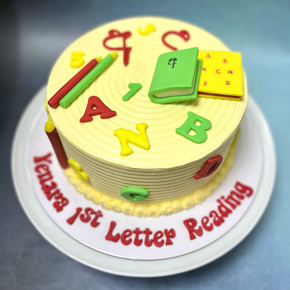 1st Letter Reading School Themed Cake